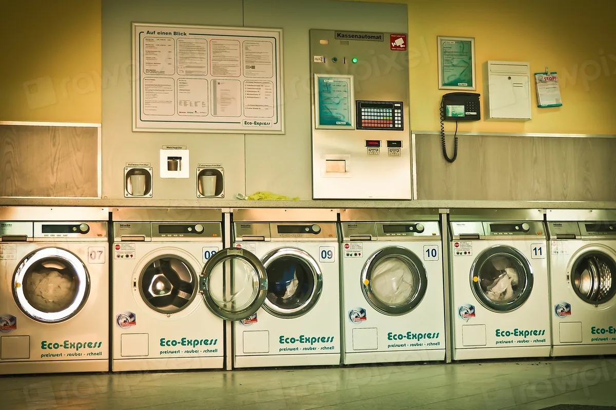 Washing machines in a bright laundry station